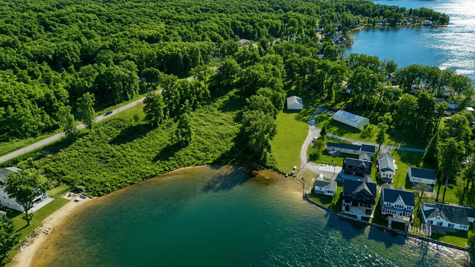Aerial view of the Devils Lake Cove parcel in summer